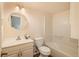 Clean bathroom with a vanity, toilet, and tub/shower combination in a bright space at 8853 N Awl Rd, Parker, CO 80138
