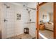 Stylish bathroom featuring a tiled shower with glass door and stone accents at 8853 N Awl Rd, Parker, CO 80138