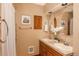 Bathroom featuring double sinks, decorative mirrors, and stylish accent lighting at 8853 N Awl Rd, Parker, CO 80138