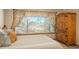 Bedroom showcasing views of the surrounding landscape through a large window at 8853 N Awl Rd, Parker, CO 80138