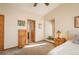 Comfortable bedroom with natural wood accents, plush carpeting, and cozy ambiance at 8853 N Awl Rd, Parker, CO 80138