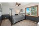 Cozy bedroom with a comfy bed, ceiling fan, and bright natural light at 8853 N Awl Rd, Parker, CO 80138