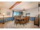 Formal dining room featuring large table, chairs, carpet, and natural light at 8853 N Awl Rd, Parker, CO 80138