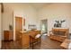 Bright kitchen with wood cabinetry, island seating, and access to an adjacent dining area with ample natural light at 8853 N Awl Rd, Parker, CO 80138
