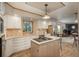 Bright kitchen featuring stainless appliances, an island and a view to the living room at 8853 N Awl Rd, Parker, CO 80138
