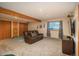 Finished basement with a comfortable seating area and natural light at 8853 N Awl Rd, Parker, CO 80138