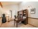 Home office features a built-in bookcase and desk, offering an inspiring workspace at 8853 N Awl Rd, Parker, CO 80138