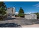 View of the house and storage shed with ample parking and beautiful landscaping at 8853 N Awl Rd, Parker, CO 80138