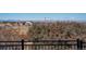 Beautiful mountain views seen from an elevated deck with metal railing surrounded by evergreen trees at 8853 N Awl Rd, Parker, CO 80138