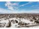 Expansive aerial view of snowy landscape and distant city skyline at 6860 E Lowry Blvd, Denver, CO 80230