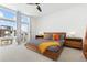 Bright bedroom with mid-century modern furniture and city views at 6860 E Lowry Blvd, Denver, CO 80230