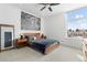 Serene bedroom with large window and mid-century modern furniture at 6860 E Lowry Blvd, Denver, CO 80230