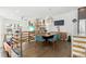 Modern dining room with lofted view and wood floors at 6860 E Lowry Blvd, Denver, CO 80230