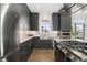 Modern kitchen with stainless steel appliances and a farmhouse sink at 6860 E Lowry Blvd, Denver, CO 80230