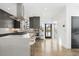 Bright kitchen with stainless steel appliances and hardwood floors at 6860 E Lowry Blvd, Denver, CO 80230