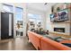 Modern living room with fireplace and city views at 6860 E Lowry Blvd, Denver, CO 80230