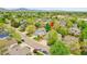 Beautiful suburban home with lush greenery, mature trees, and well-maintained landscaping at 10653 W Parkhill Dr, Littleton, CO 80127