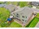 Home offers a backyard deck, large windows, and mature landscaping from this aerial shot at 10653 W Parkhill Dr, Littleton, CO 80127