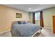 Comfortable bedroom with blue patterned bedding and a serene ambiance at 10653 W Parkhill Dr, Littleton, CO 80127
