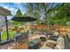 Inviting outdoor deck with dining and lounge seating, ideal for relaxing and entertaining outdoors at 10653 W Parkhill Dr, Littleton, CO 80127