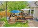 Multi-level deck with comfortable seating and dining areas, perfect for outdoor relaxation and entertaining at 10653 W Parkhill Dr, Littleton, CO 80127