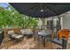 Relaxing deck with outdoor seating and a shaded umbrella at 10653 W Parkhill Dr, Littleton, CO 80127