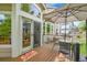 Outdoor deck featuring dining set, umbrella, and access to the interior through a glass door at 10653 W Parkhill Dr, Littleton, CO 80127
