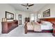 Main bedroom with ample dresser storage, ceiling fan, and neutral colors at 10653 W Parkhill Dr, Littleton, CO 80127