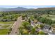 Aerial view of a neighborhood featuring lush trees and green spaces at 12992 W Jewell Cir, Lakewood, CO 80228