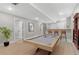 Finished basement featuring a pool table, bar area, and recessed lighting at 12992 W Jewell Cir, Lakewood, CO 80228