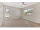 Bedroom with neutral walls, carpet, and large windows for ample natural light at 12992 W Jewell Cir, Lakewood, CO 80228