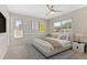 Serene bedroom featuring neutral tones, ample natural light, and a comfortable queen-size bed at 12992 W Jewell Cir, Lakewood, CO 80228