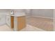 A cozy kitchenette area featuring laminate flooring and quartz countertops at 12992 W Jewell Cir, Lakewood, CO 80228