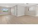 Expansive living area showcasing wood flooring, neutral paint, and abundant natural light at 12992 W Jewell Cir, Lakewood, CO 80228