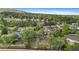 Lush neighborhood featuring varied home styles, mature trees, and proximity to community amenities creating an inviting residential area at 12992 W Jewell Cir, Lakewood, CO 80228