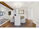 Elegant dining room with hardwood floors, modern lighting, and views into the living area at 4850 S Kittredge St, Aurora, CO 80015