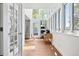 Sun room off the kitchen with large windows offering natural light at 4850 S Kittredge St, Aurora, CO 80015