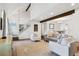 Spacious living room with hardwood floors, a staircase, and an open connection to the dining area at 4850 S Kittredge St, Aurora, CO 80015