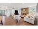 Cozy living room features a stone fireplace, hardwood floors, and neutral color scheme at 4850 S Kittredge St, Aurora, CO 80015