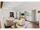 Bright and airy living room with hardwood floors, neutral decor, and large windows at 4850 S Kittredge St, Aurora, CO 80015