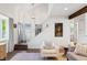 Bright and airy living room featuring a soaring ceiling, wood floors, and modern decor at 4850 S Kittredge St, Aurora, CO 80015