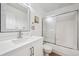 Bright bathroom with white vanity, silver hardware, shower and tub combo, toilet, and tile flooring at 748 Poppywood Pl, Highlands Ranch, CO 80126