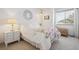 Cozy bedroom with a full bed, bedside table, and chest near window at 748 Poppywood Pl, Highlands Ranch, CO 80126