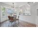 Bright breakfast nook with bay windows and modern lighting, perfect for casual dining at 748 Poppywood Pl, Highlands Ranch, CO 80126