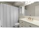 Neutral bathroom featuring a vanity with white countertops and a shower with a white shower curtain at 412 Main St # 2A3, Breckenridge, CO 80424