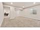 Finished basement space perfect for entertaining, featuring neutral colors and ample lighting at 627 Millbrook Cir, Castle Rock, CO 80109