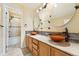 Modern bathroom with double sinks, granite countertop, and updated fixtures at 627 Millbrook Cir, Castle Rock, CO 80109