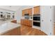 Modern kitchen with wood cabinets, stainless steel appliances, and sleek countertops at 627 Millbrook Cir, Castle Rock, CO 80109