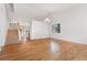 Open-concept living room with hardwood floors and abundant natural light at 627 Millbrook Cir, Castle Rock, CO 80109