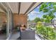 Large outdoor balcony featuring wicker furniture and scenic views of the city skyline at 4801 E 9Th Ave # 402S, Denver, CO 80220